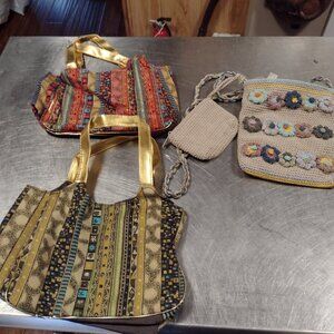 2 makeup bags and a pocketbook with change purse